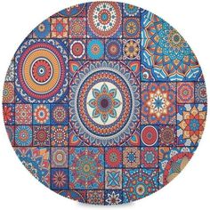 an artisticly designed plate with many different colors and designs on it's surface