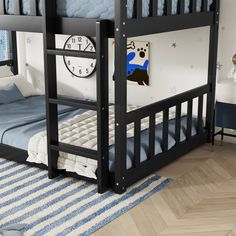 a bunk bed with a blue and white striped rug on the floor next to it