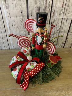 a nutcracker arrangement with candy canes and decorations