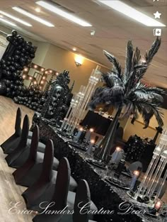 the tables are set with black and silver decorations