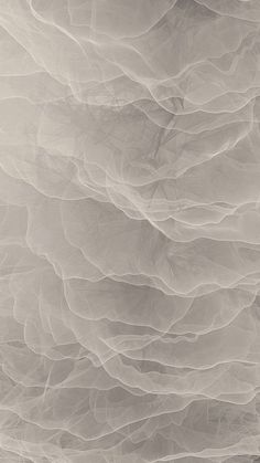 an abstract photograph of white and gray paper with wavy lines on the bottom right corner