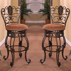 two brown stools sitting next to each other in a room