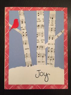 a christmas card with birch trees, birds and music notes on it that says joy