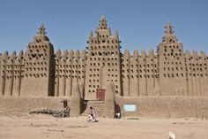 a large sand castle built into the side of a beach