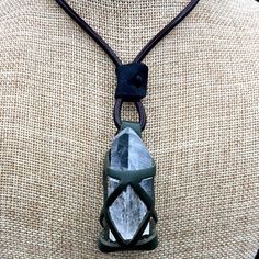 This is a fun, crystal and stone holder necklace; also known as a cage necklace, for crystals that features a leather cord with leather cage to hold a crystal point. This specimen holding necklace is also the perfect size to hold other rock specimens. Measurements of the cage are: 1.5 inches by 0.50 inches. This necklace is adjustable from choker length to 24 inches. Available colors: black, red, blue and brown cage. *Please note: Crystal not included Cleaning Instructions: You can use a soft mi Adjustable Crystal Necklace With Large Stone In Spiritual Style, Adjustable Spiritual Crystal Necklace With Large Stone, Crystal Holder Necklace Diy, Crystal Stone Holder Necklace, Diy Stone Cage Necklace, Crystal Cage Necklace Diy, Holding Necklace, Stone Holder Necklace, Crystal Holder Necklace