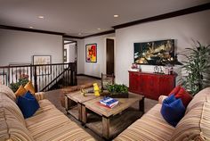 a living room filled with furniture and a wooden coffee table