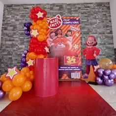 balloons and decorations are on display at the entrance to a children's birthday party