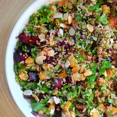 a white bowl filled with lots of food