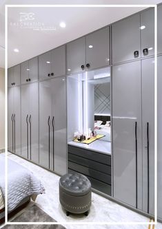 a bedroom with gray cabinets and white walls