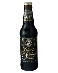 a bottle of black and gold alet beer on a white background with the label below it