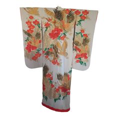 Vintage brocade Japanese ceremonial kimono a vintage Mid-Century ivory color collectible Japanese ceremonial kimono. One of a kind hand crafted work of art.  Fabulous museum quality ceremonial piece in pure silk with intricate detailed hand-embroidery throughout accented with floral heavy embroidery lame threads work that depicts, Birds, flowers, with designs in heavy gold threads, red and gold and black accents, all of them traditional symbols of prosperity and auspiciousness.   Opt for a uniqu Cream Silk Kimono For Wedding, Traditional White Kimono For Ceremonies, Traditional White Kimono For Wedding, Traditional Cream Kimono, White Long Silk Kimono, Ceremonial Vintage Kimono, White Long Vintage Kimono, Long White Vintage Kimono, Traditional Long Kimono For Ceremonies