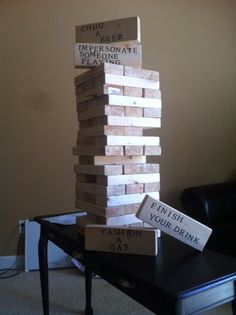 a stack of wooden blocks sitting on top of a table next to a black chair