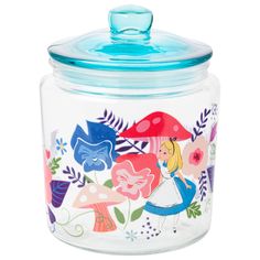 a glass jar with an image of alice and the wonderlands on it's lid