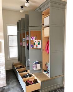 an organized closet with drawers and shoes in it