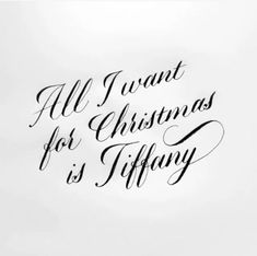 the words all i want for christmas is tiffany written in cursive black ink