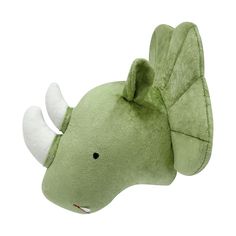 a green stuffed animal with horns on it's head