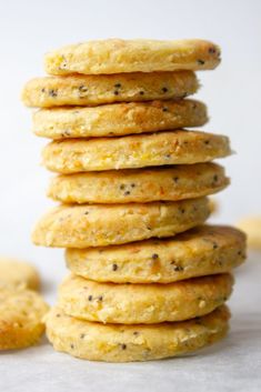 a stack of carrot cheddar and poppy seed crackers with text overlay