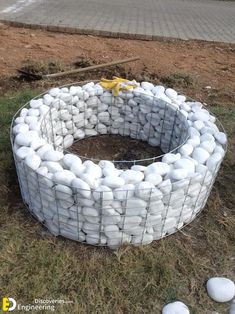 an outdoor fire pit made out of white rocks