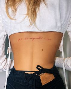 the back of a woman's stomach with an inscription on it that says, you are