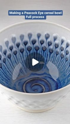 a blue and white bowl sitting on top of a table