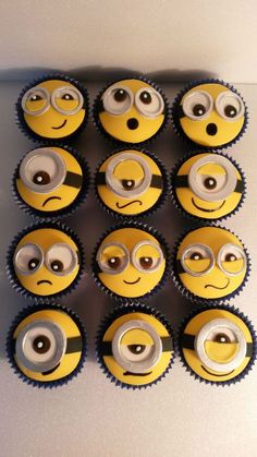 cupcakes with eyes and mouths are arranged in the shape of minion faces