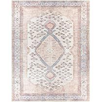 a rug with an intricate design on the front and back side, in light pink tones