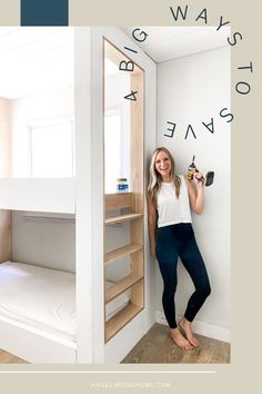 a woman standing next to a bunk bed in a room with white walls and wood flooring