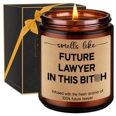 a candle that says smells like future lawer in this bith with a yellow bow around it