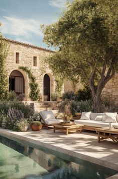 an outdoor pool with lounge chairs next to it