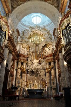 the inside of a church with an ornate alter