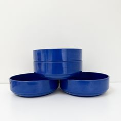 three blue bowls stacked on top of each other