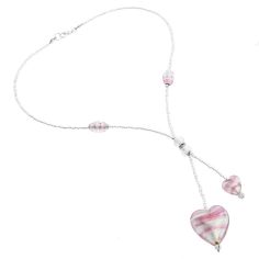 A statement of feminine beauty, elegance, and style, this Murano Heart Necklace is an instant hit with women of all ages and tastes. The authentic Murano Glass Tie necklace features two handcrafted hearts in tender shades of pink shimmering with infused 925 silver and suspended from strings of exquisite silver seed beads. The matching silver-lined Murano Glass beads in the middle and on the sides along with Swarovski crystals complete the stylish look. This necklace is a great way to show your l Murano Glass Necklaces, Murano Glass Jewelry, Tie Necklace, Murano Glass Beads, Handcrafted Artisan Jewelry, Glass Heart, Venice Italy, Glass Necklace, Glass Crafts