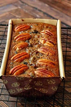 there is a cake that has been baked in the oven with pecans on top