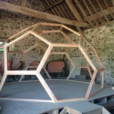 the inside of a building that has been constructed with wood and metal pieces in it