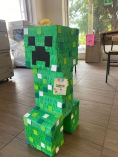 a green chair made out of lego blocks