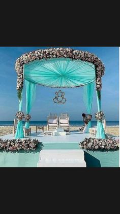 an outdoor wedding set up on the beach