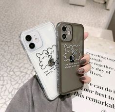 two iphone cases with cartoon drawings on them