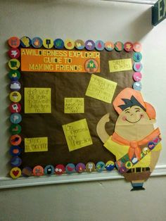 a bulletin board with writing and pictures on it