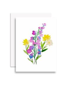 a card with watercolor flowers on it