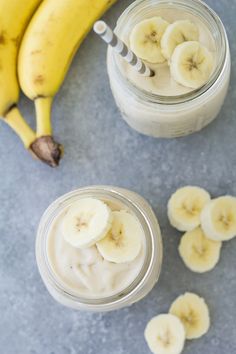 bananas and yogurt in small jars with spoons