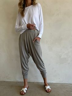 Imagine slipping into a pair of pants that blend the timeless comfort of traditional joggers with the laidback charm of harem pants. Introducing Pants de Fleur, in our signature luxury modal, a revolutionary new jogger style pant that takes your everyday living to a whole new level of comfort and style. Details Runs large, if between sizes, size down Sizing selections based on how baggy, generous versus fitted and less generous 92% heavyweight micro modal jersey | 8% spandex Signature beechwood Comfy Travel Outfit, Comfy Travel, Style Pant, Harem Pant, Drop Crotch Pants, Travel Wear, Travel Pants, Jersey Pants, New Pant