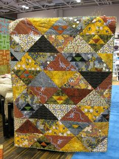 a large quilt on display in a store