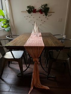 a wooden table with chairs around it