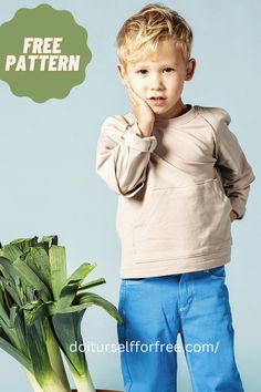 a little boy standing next to a bunch of broccoli with the caption free pattern