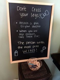 a chalkboard sign that says don't cross your legs to win at the bottom