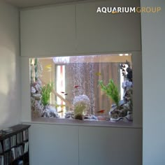 an aquarium in the corner of a room