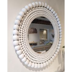 a mirror that is hanging on the wall