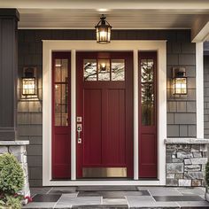 a red front door with two sidelights