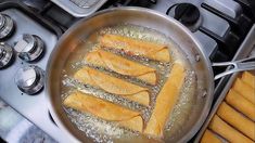 some food is cooking in a pan on the stove