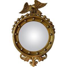 a mirror with an eagle on the top